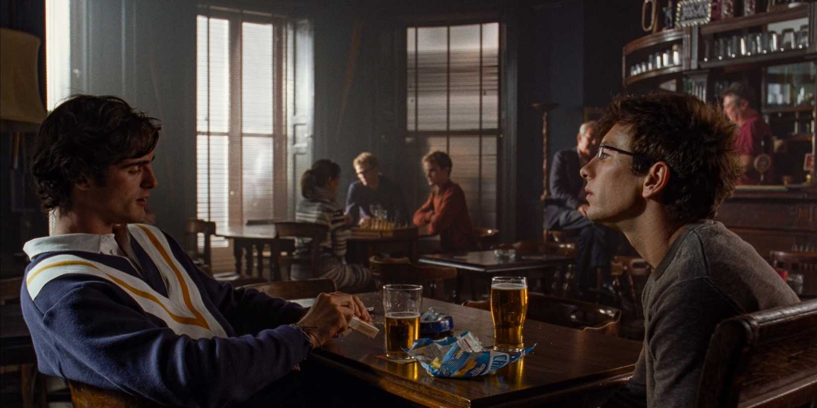 Oliver and Felix chatting over a couple of pints in the pub at Oxford in Saltburn.