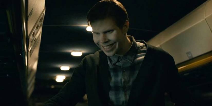 A creature in the TV show From, with an eerie smile