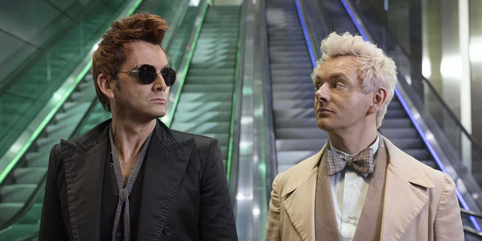 Crowley and Aziraphale looking at each other suspiciously in Good Omens