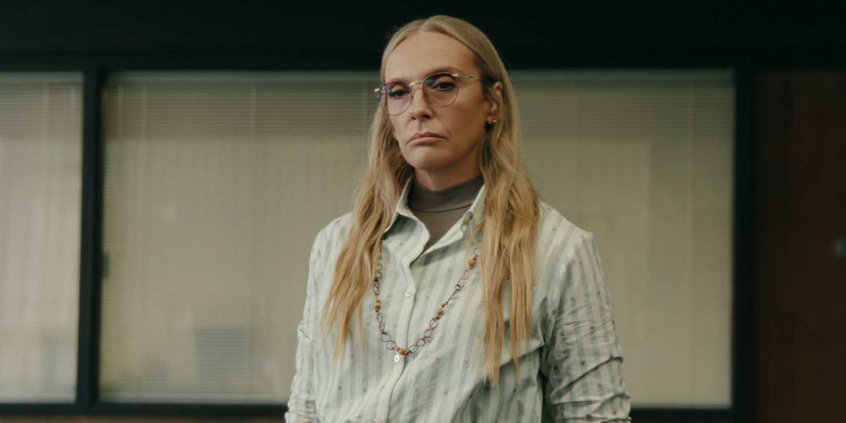 Evelyn Wade glaring while standing in Tall Pines Academy in Netflix's Wayward