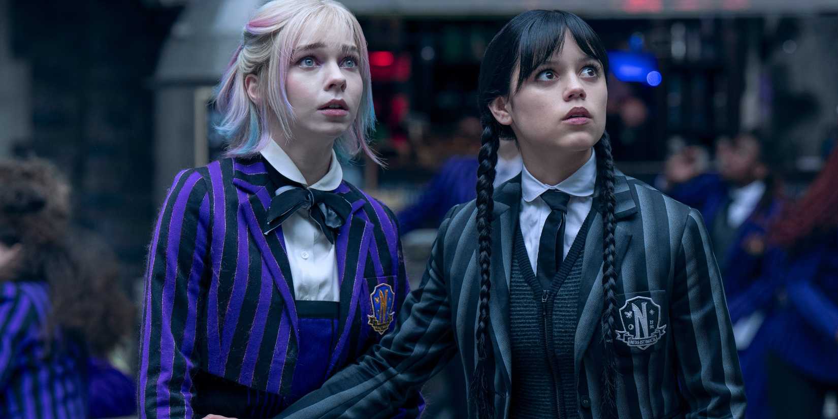 Wednesday and Enid in looking scared in Wednesday