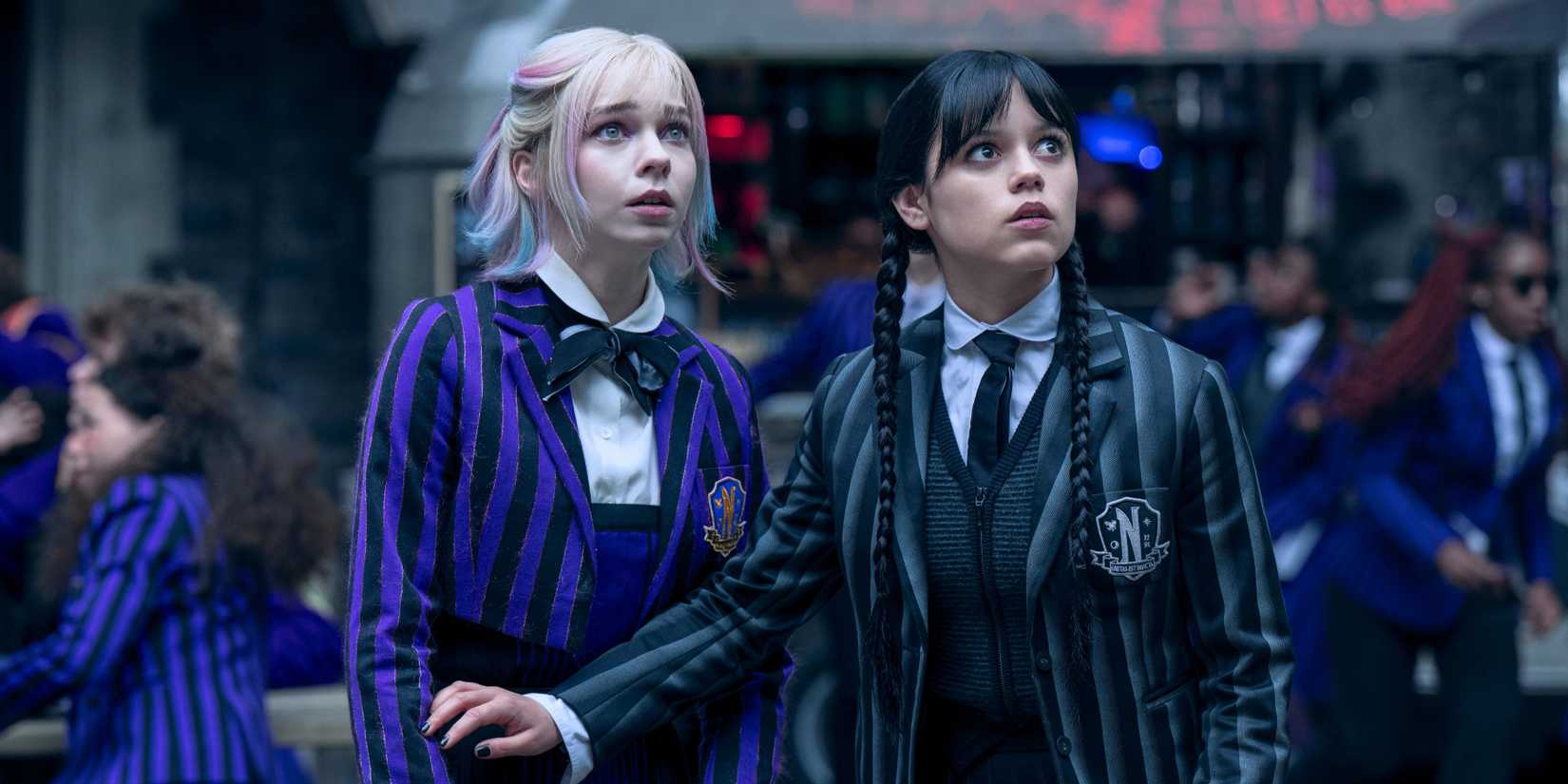 Wednesday and Enid look panicked in Wednesday season 2