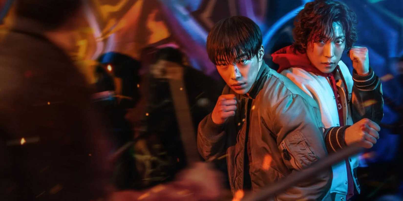 Woo Do-hwan and Lee Sang-yi together in fighting stances against a faceless thug in Bloodhounds