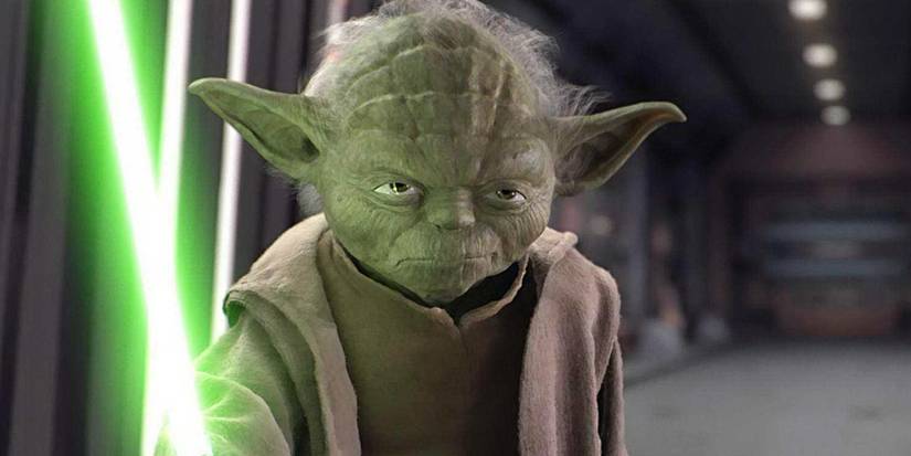 Master Yoda wielding his green lightsaber in Revenge of the Sith