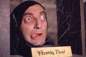 Igor with his tongue sticking out in front of a freshly dead sign in Young Frankenstein