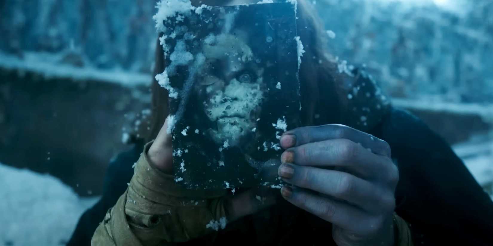 A pH๏τo of Frankenstein's monster holding up an image