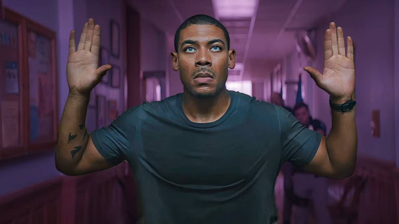 Aaron Pierre as Terry Richmond with his hands up in Rebel Ridge