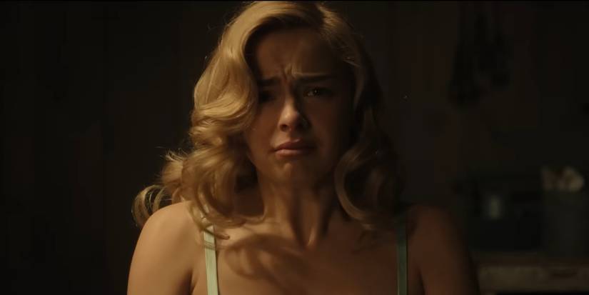 Addison Rae as Evelyn Hartley looking upset in Monster: The Ed Gein Story 