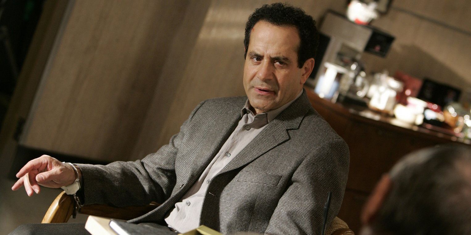 Adrian Monk sitting down and talking in Monk