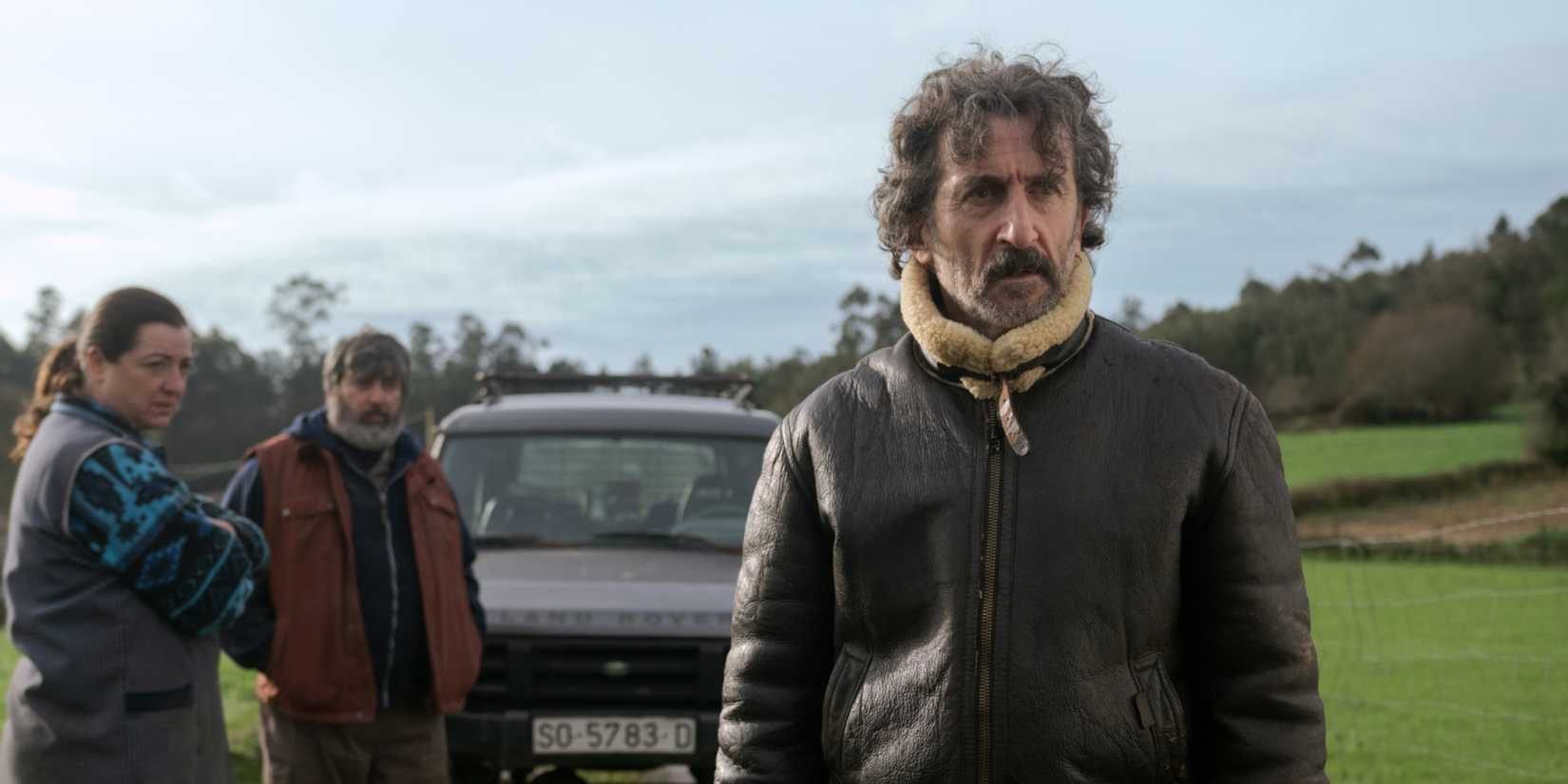Anton with a couple behind him in Old Dog New Tricks