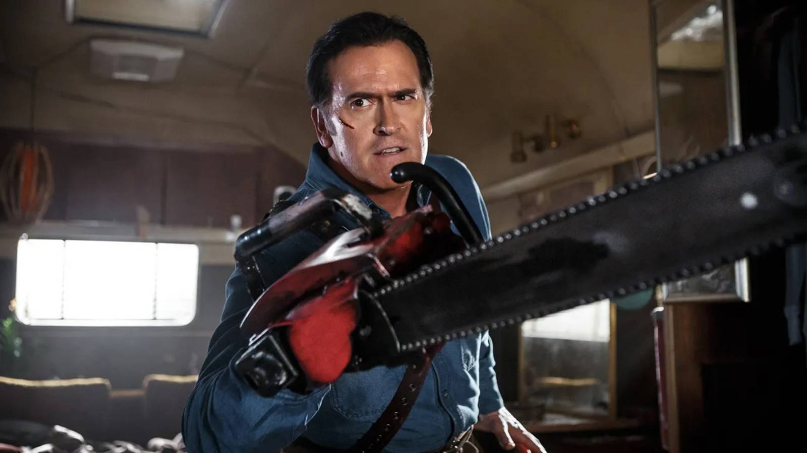 Ash holds his chainsaw toward the camera in Ash vs. the Evil Dead