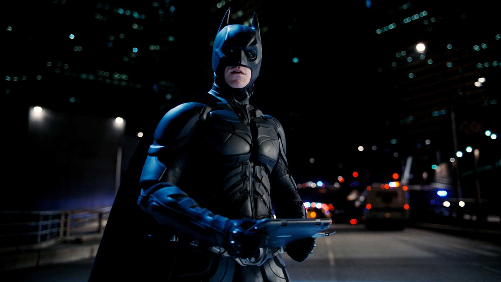 Batman holding a controller in The Dark Knight Rises