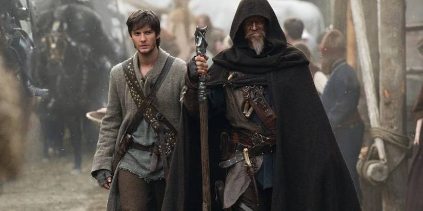 Ben Barnes and Jeff Bridges walking down a dusty street in Seventh Son