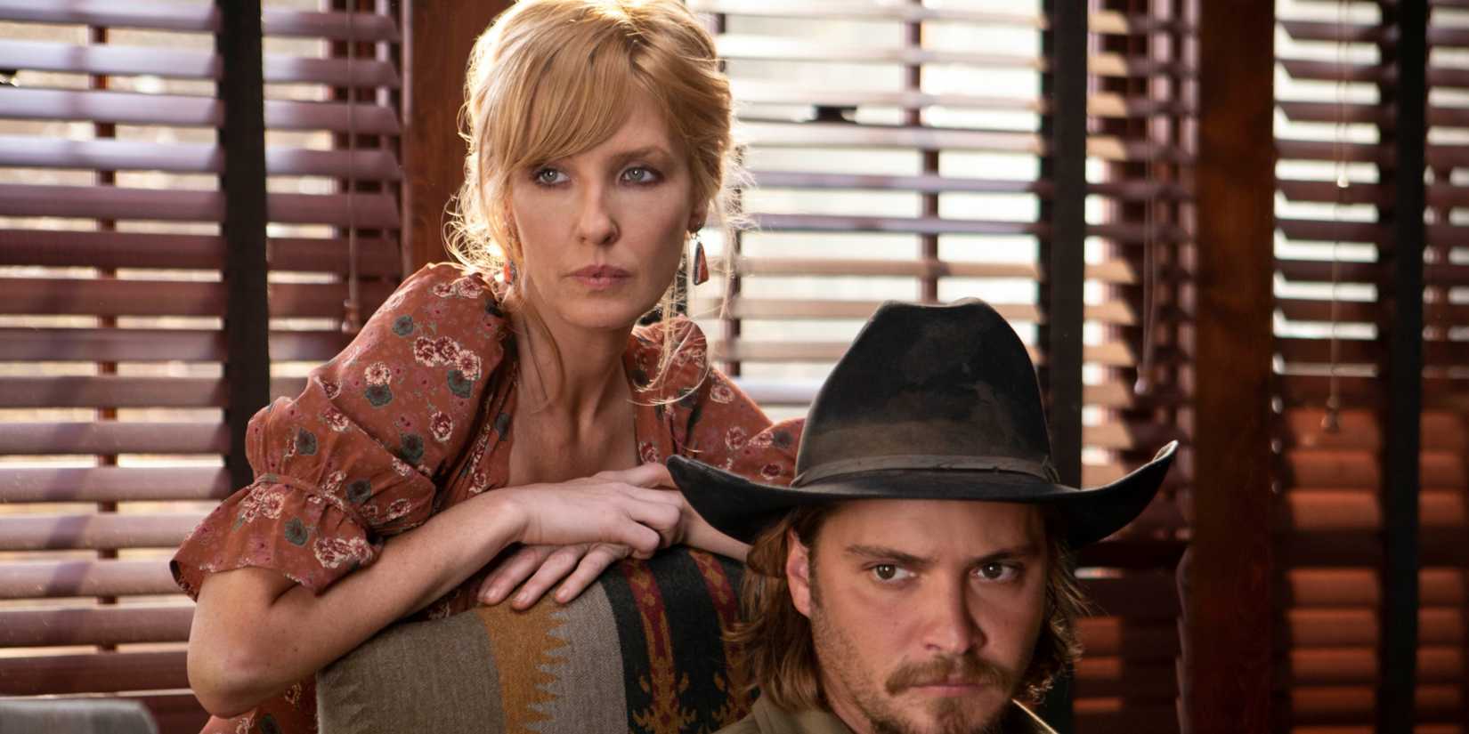 Beth (Kelly Reilly) and Kayce Dutton (Luke Grimes) at the family table looking angry in Yellowstone