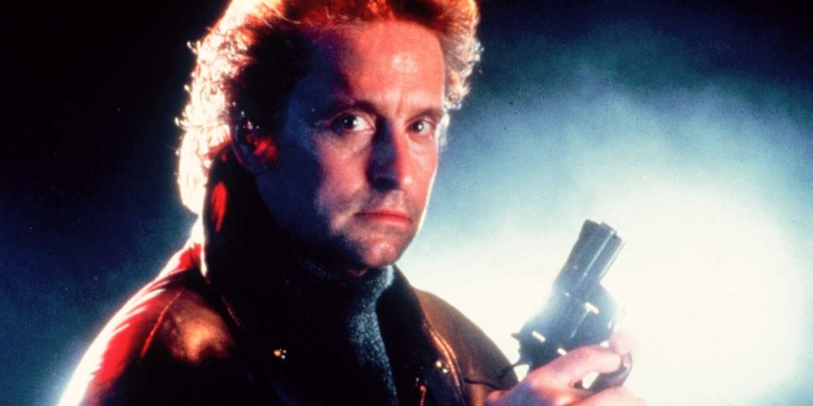 Michael Douglas holds a pistol in a promo image for Black Rain