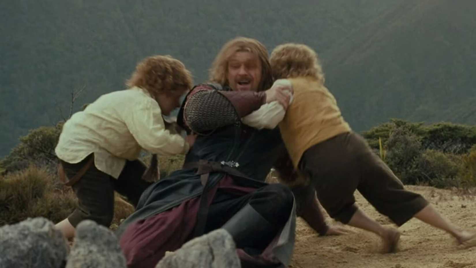 Boromir wrestling with the Hobbits in Lord of the Rings