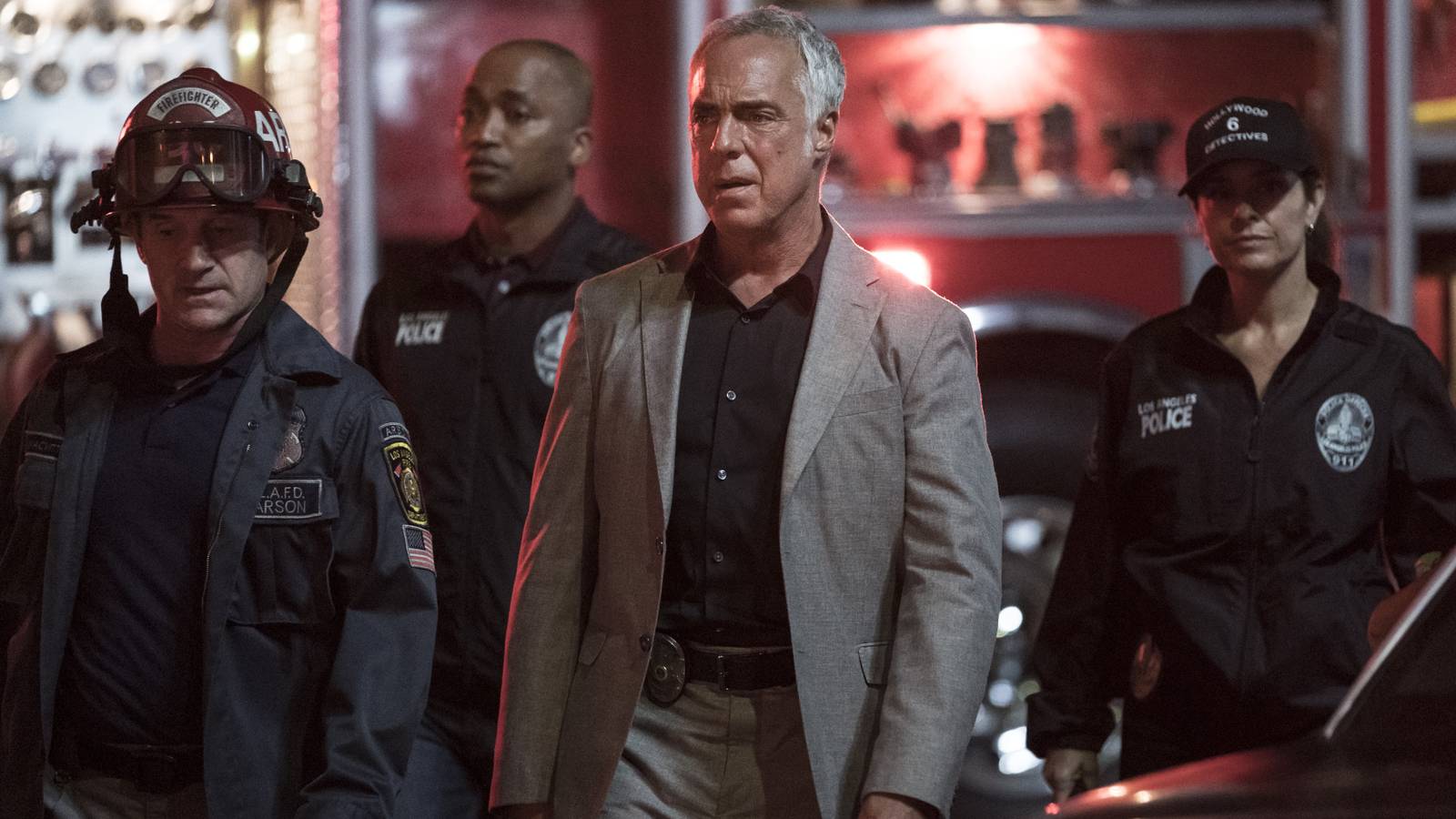 Titus Welliver as Harry Bosch surrounded by police in uniform in Bosch