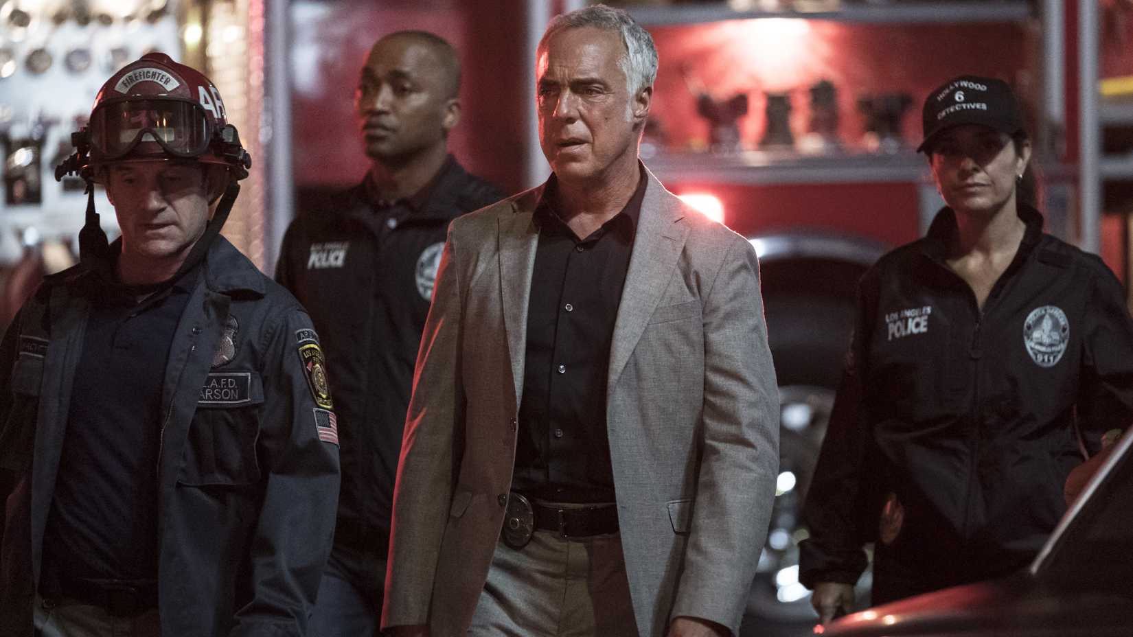 Titus Welliver as Harry Bosch surrounded by police in uniform in Bosch