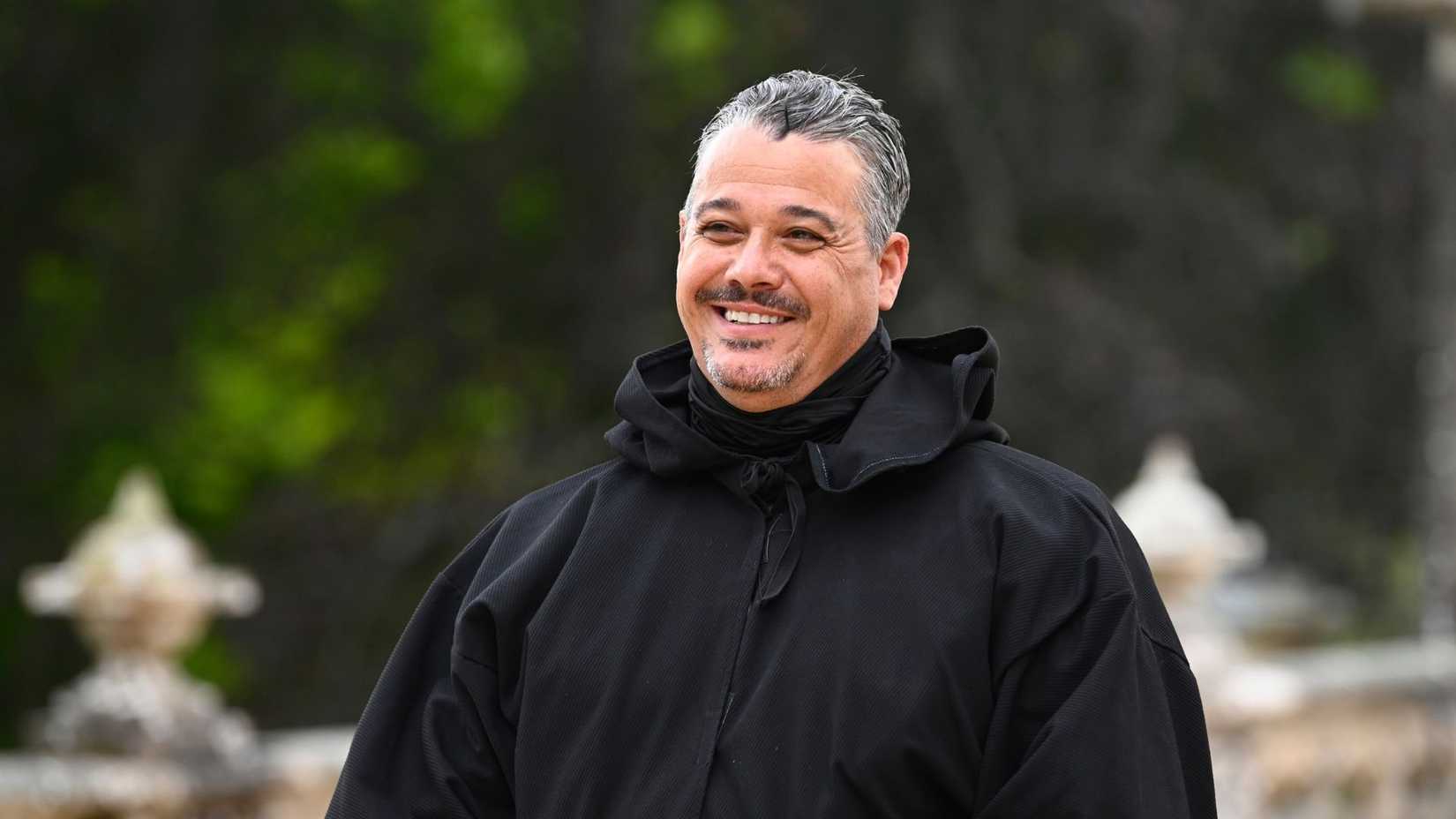 Boston Rob smiling in the robe on the Traitors