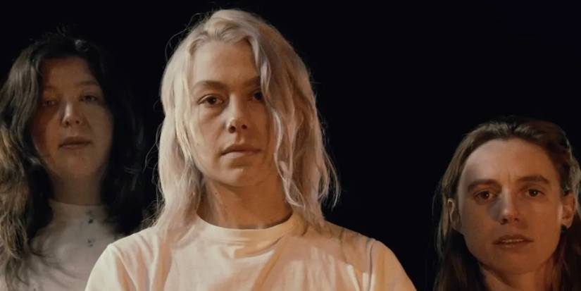 Lucy Dacus, Phoebe Bridgers, and Julien Baker looking into the camera for the "Emily I'm Sorry" music video