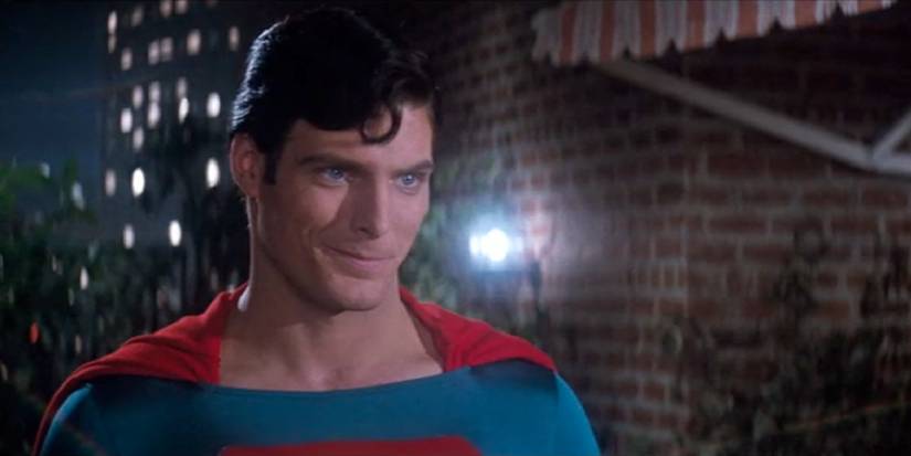 Christopher Reeve's Superman smiling at Lois Lane on rooftops in Superman the movie 1978