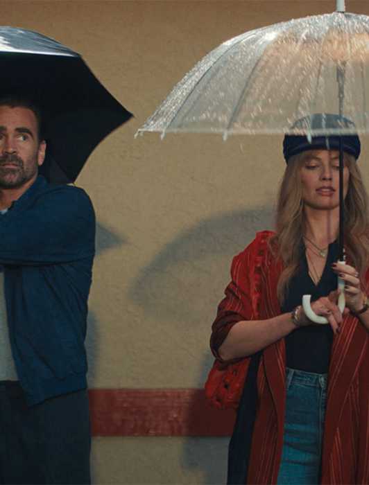 Colin Farrell & Margot Robbie Grab A Bite In A Big Bold Beautiful Journey Extended Scene Colin Farrell & Margot Robbie holding umbrellas in A Big Bold Beautiful Journey