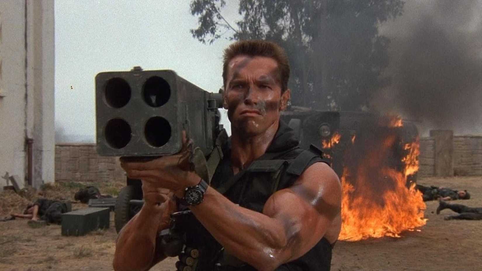 Arnold Schwarzenegger aims a massive rocket launcher in Commando