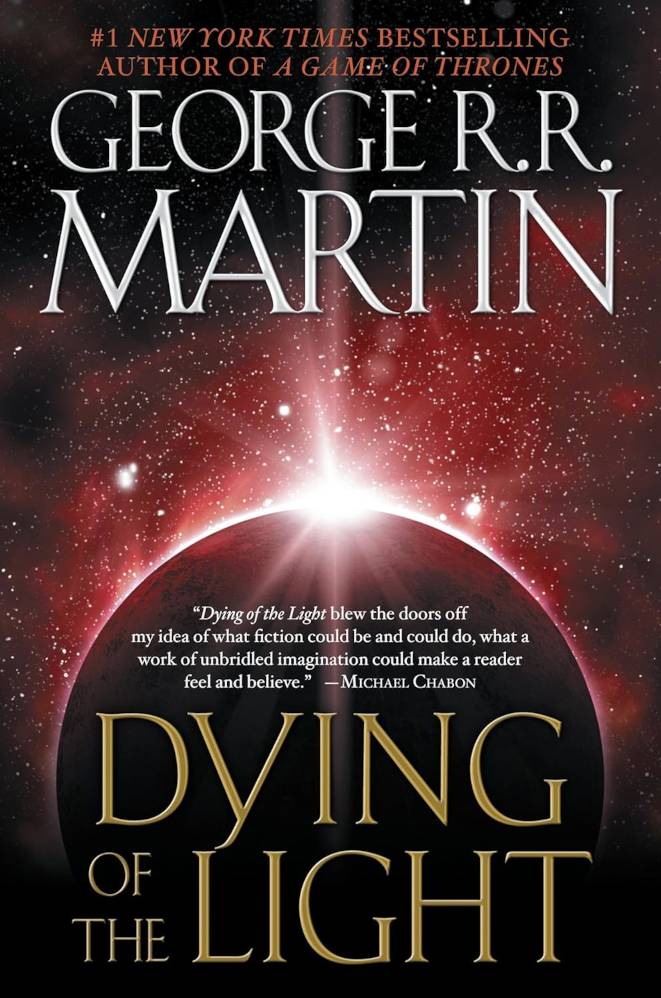 The cover of Dying Of The Light By George RR Martin featuring a red starry sky and eclipse