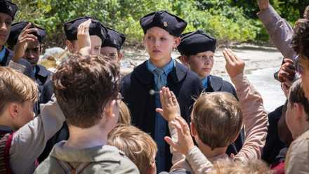 Ensemble Biguns and Littluns (Supporting artists) with Jack (Lox Pratt) centred, and Maurice (Cornelius Brandreth) in BBC's Lord of the Flies
