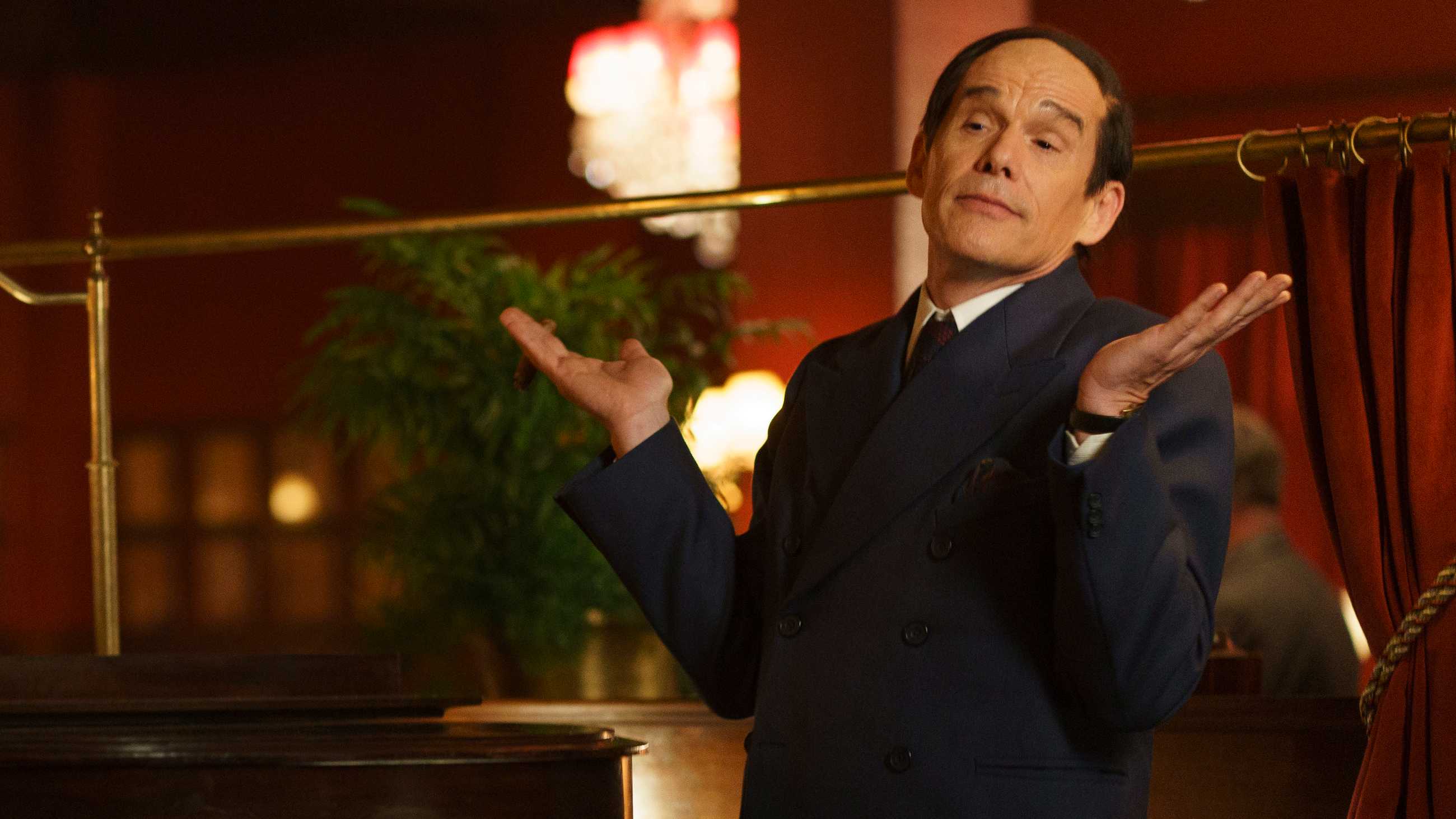 Ethan Hawke's Lorenz Hart holding his hands out in humorous disinterest in Blue Moon