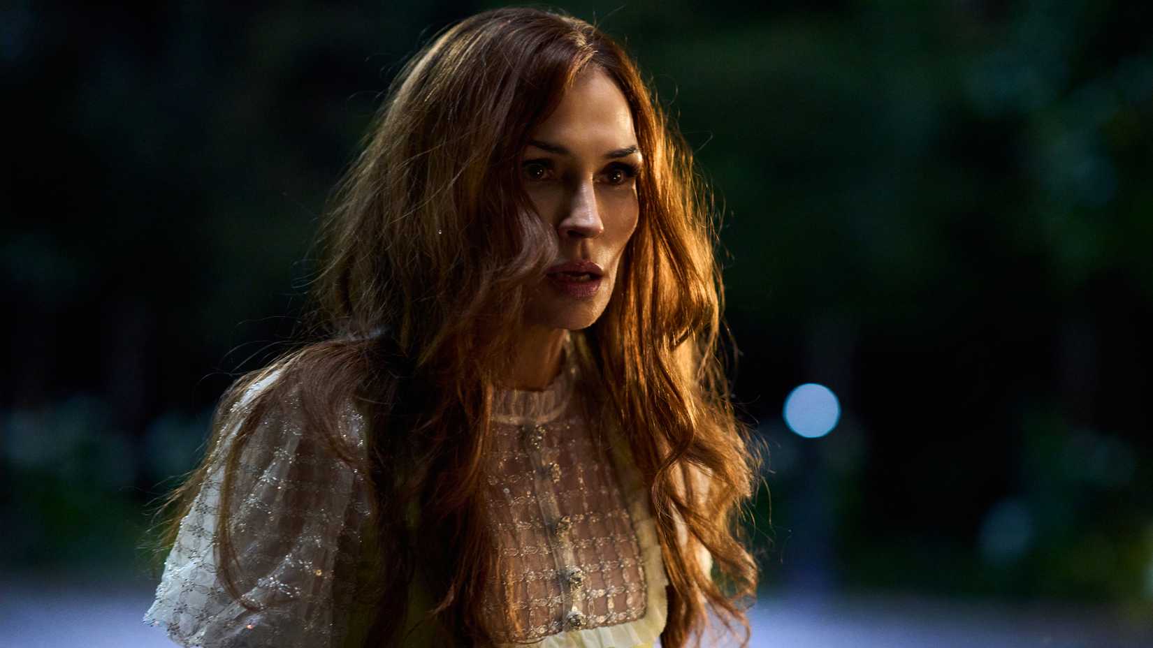 Famke Janssen's Betty looking upset at someone in Amsterdam Empire