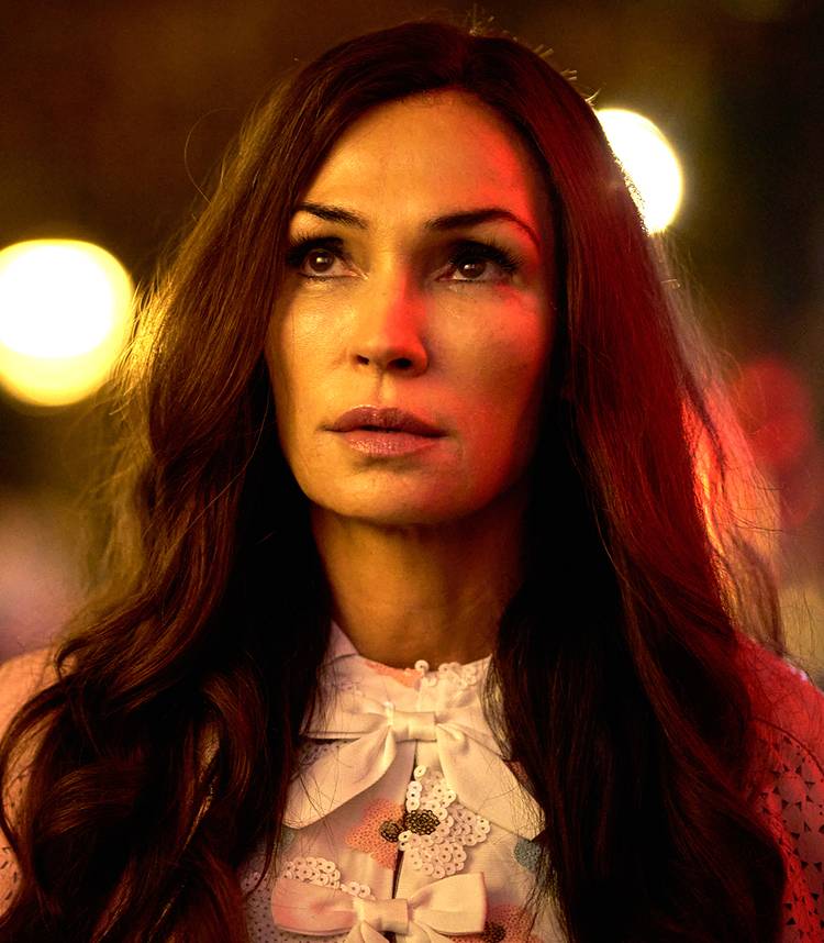 Famke Janssen's Betty looking upward in thought in Amsterdam Empire