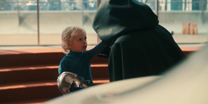 franklin richards touching dooms face while holding his mask in fantastic four first steps