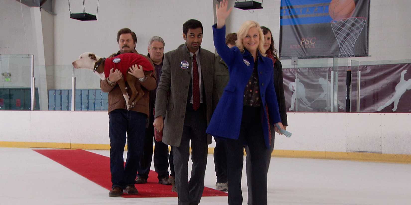 Leslie Knope and her colleagues walking across an ice rink in Parks and Rec
