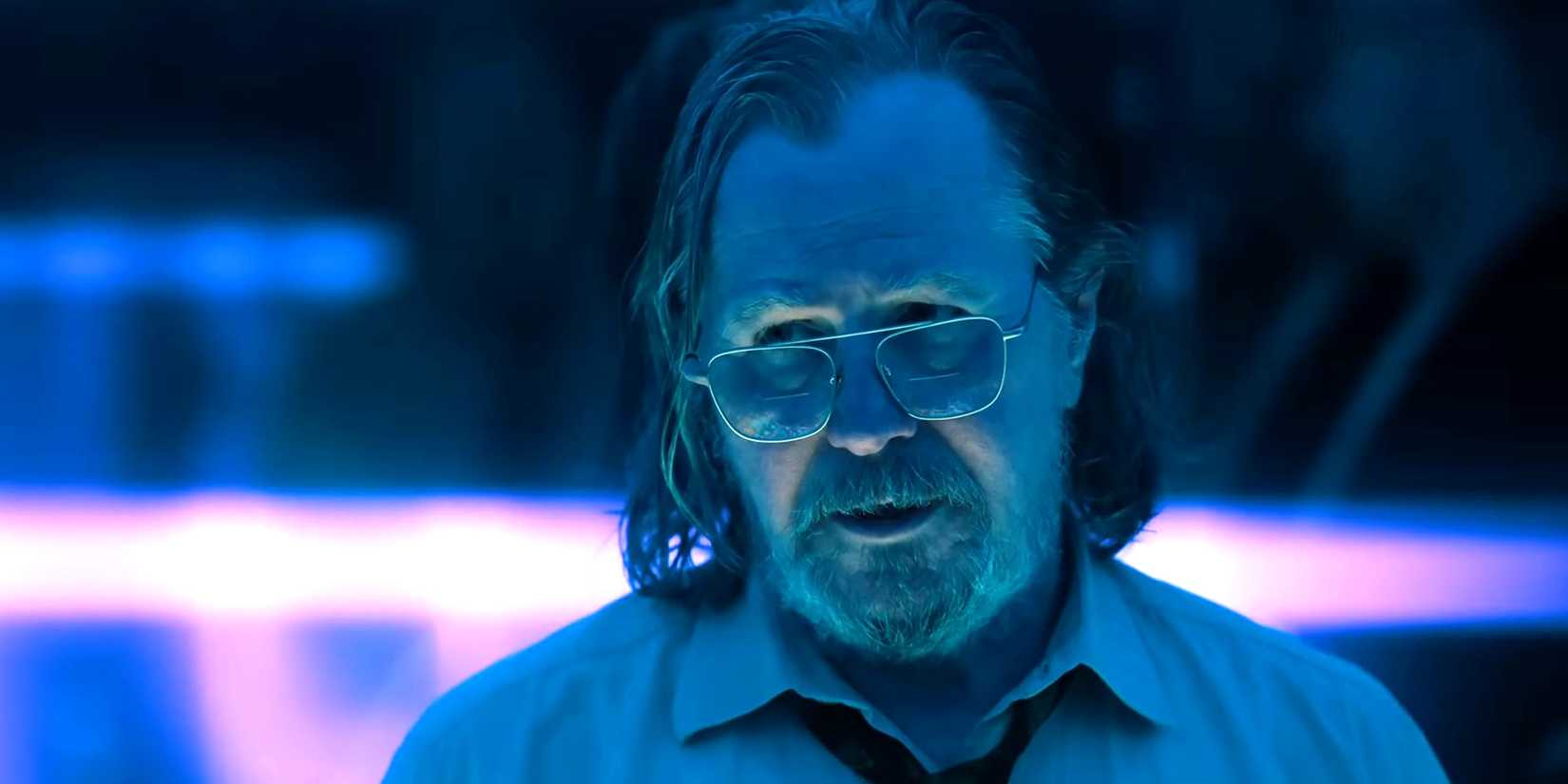 gary oldman s lamb looking worried in a neon lit room in slow horses season 5