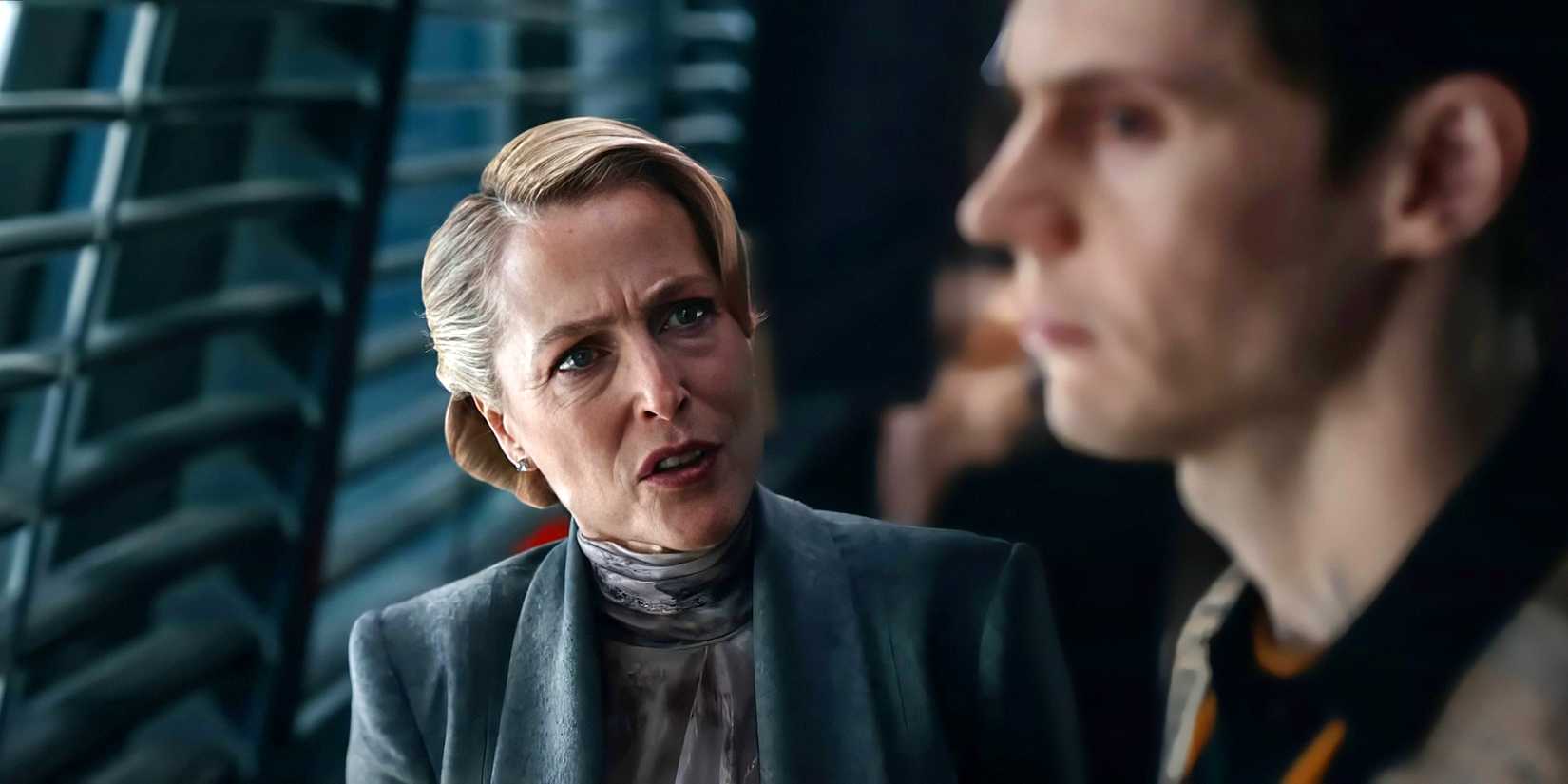 Gillian Anderson's Elisabeth talking angrily at Evan Peters' Jullian in Tron: Ares