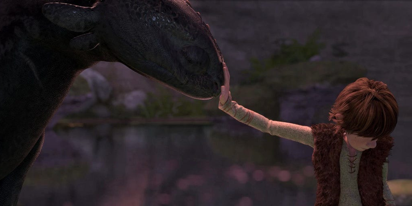 Hiccup touching Toothless for the first time in How To Train Your Dragon