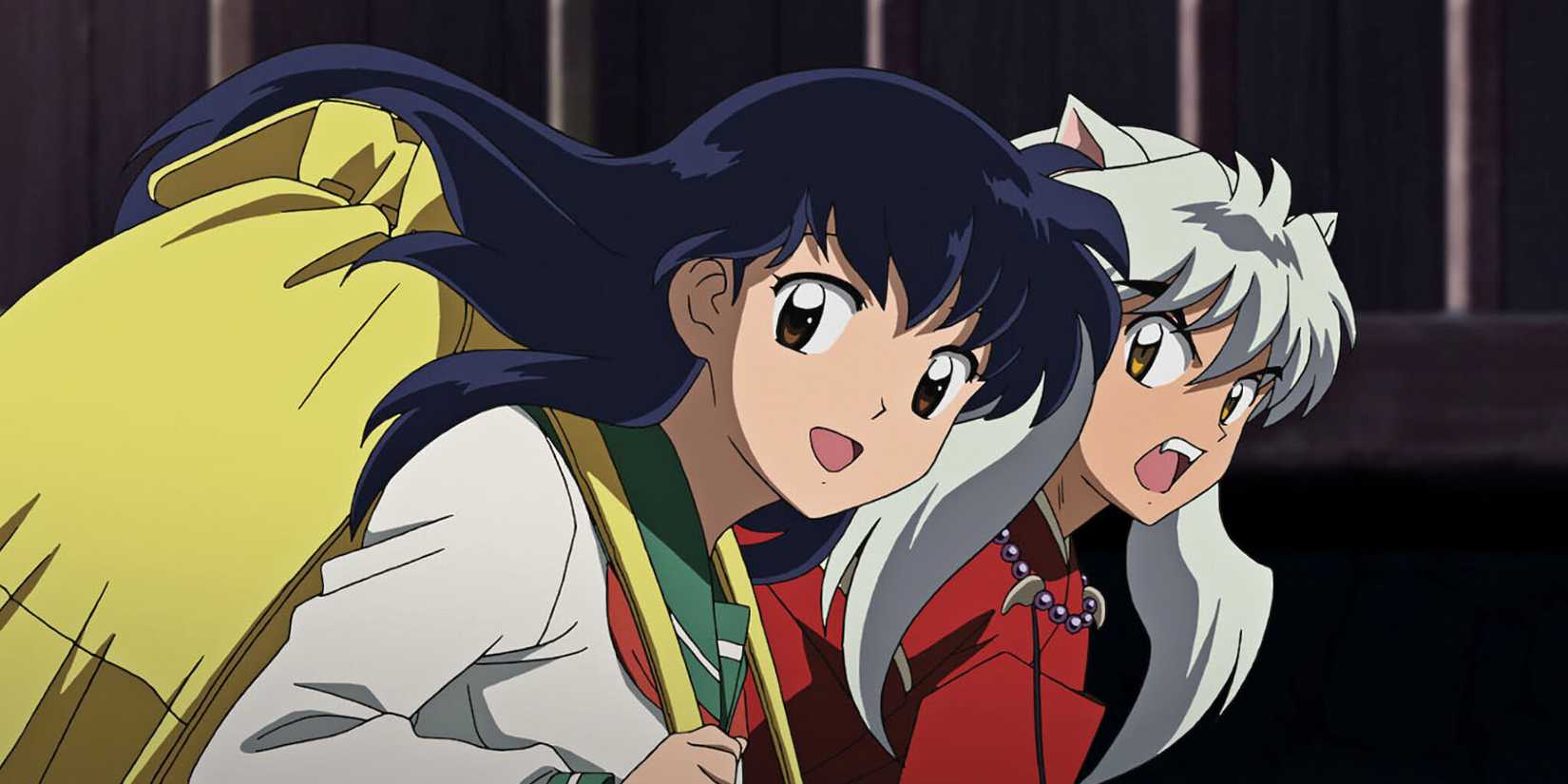 Kagome smiling and Inuyasha appearing annoyed while the two run side by side.