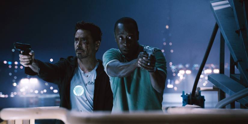 Tony Stark and James Rhodes holding guns in Iron Man 3