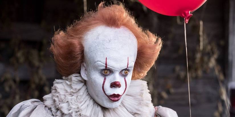 Pennywise holding a red balloon