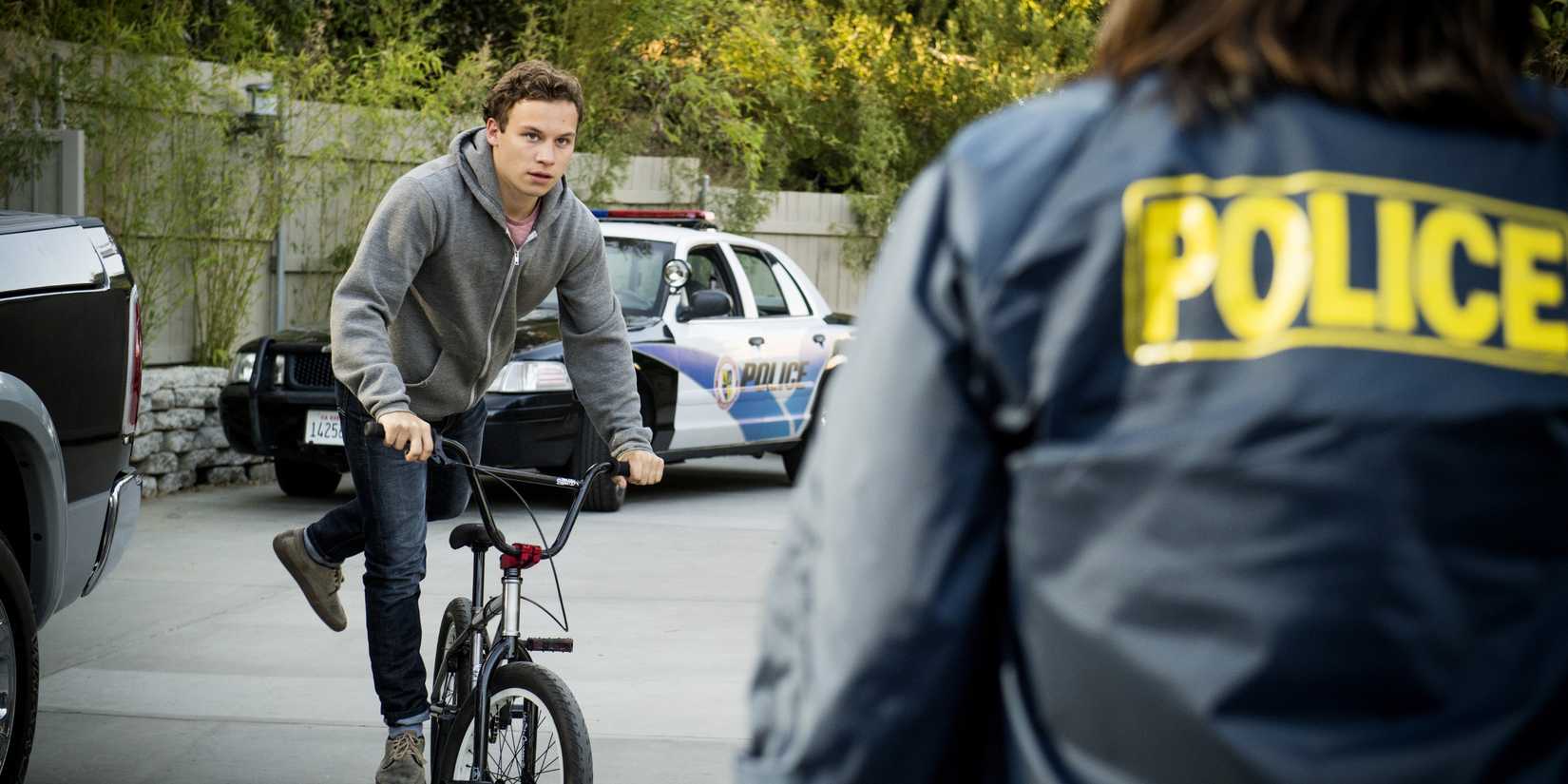 J approaching a police officer in the Animal Kingdom episode What Have You Done