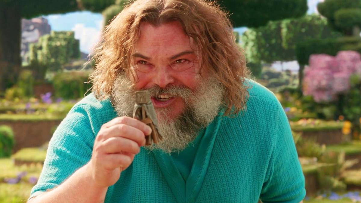 Jack Black as Steve excitedly holding up a small object in A Minecraft Movie