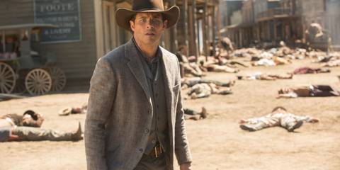 James Marsden as Teddy Flood in Westworld, standing confused in an old West style town, surrounded by dead bodies