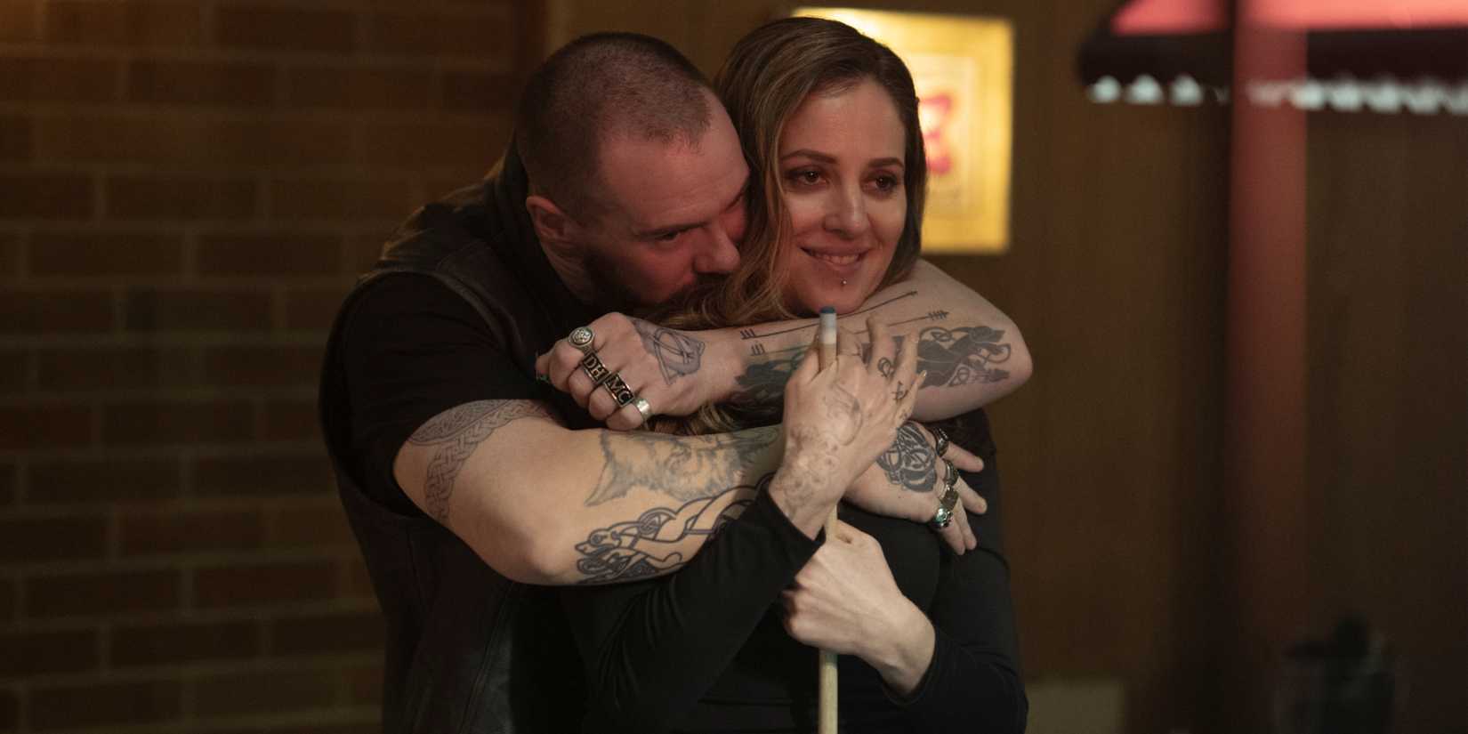 Jayson hugging Eryn from behind in Task