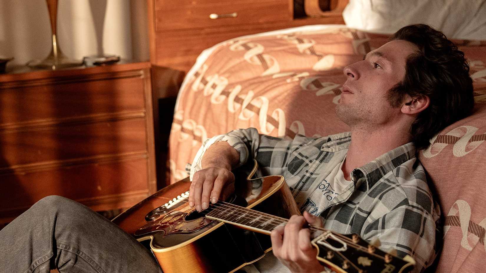 Jeremy Allen White's Bruce Springsteen playing guitar in Deliver Me From Nowhere