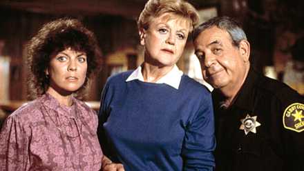 Jessica Fletcher standing with another woman and a sheriff in Murder, She Wrote