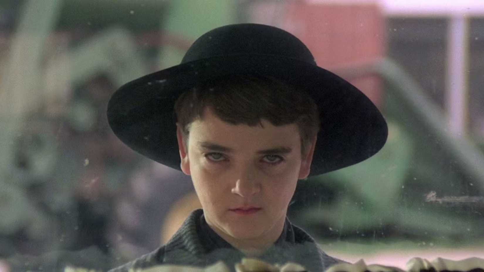 John Franklin as Isaac looking through a window in Children of the Corn