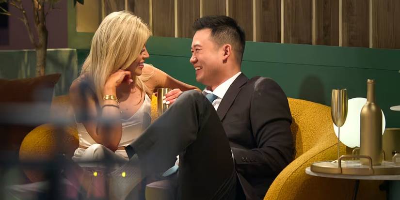 Kacie McIntosh and Patrick Suzuki sit on a couch, smiling, after first meeting on Love Is Blind season 9