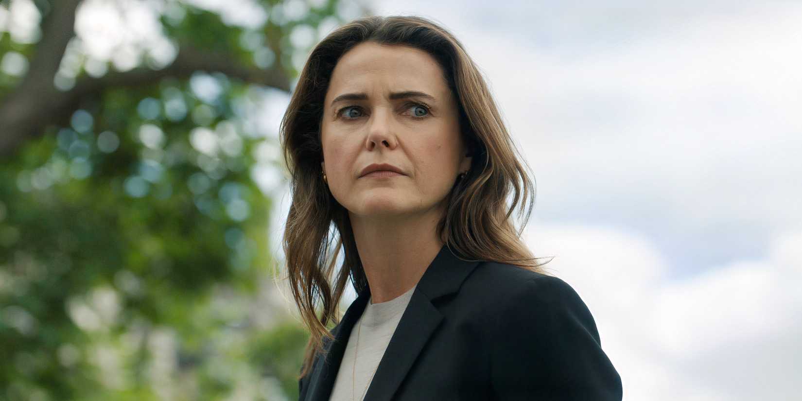 Netflix's 12-Year Political Thriller Struggle Ends with The Diplomat Season 3 Kate standing outside in The Diplomat season 3