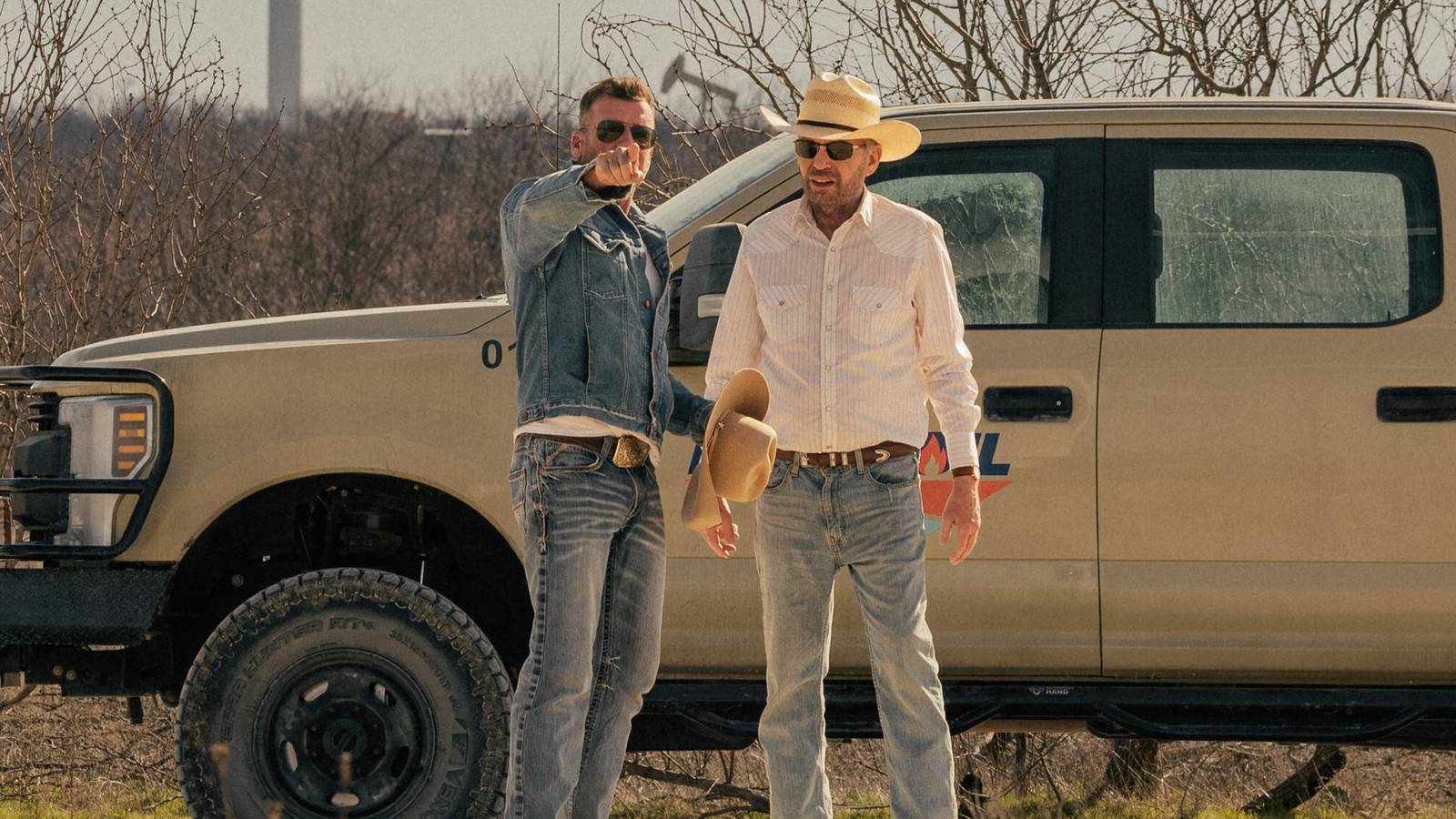 Taylor Sheridan pointing next to Billy Bob Thornton between takes in Landman